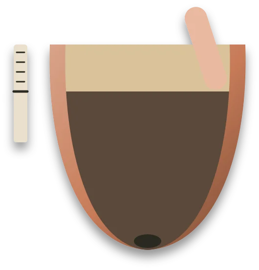 A cut-away pot with a pale, dry top layer of compost over darker, damp compost, and a finger pressed into the top layer.